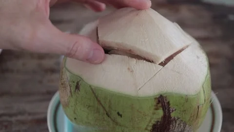 POV Hands Opening Top Of Fresh Green Young Thai Coconut, Drink Coco Water Juice Stock-Footage 237587597