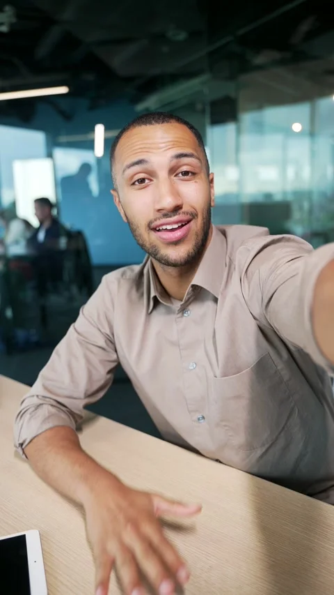 POV of handsome worker making selfie video call while sitting in modern office.  Stock Footage 255972714