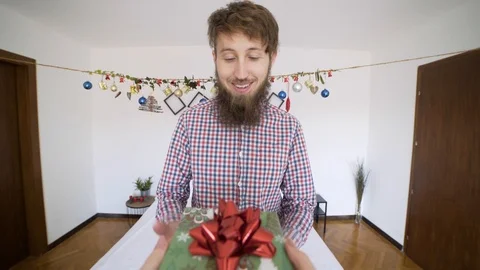 POV of happy man receiving present in authentic room. Stock Footage 102655747