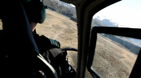 POV Helicopter Flying extremely low through valley Stock Footage 35129623