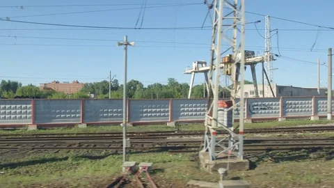 POV: High-speed Train moves past a railway station in the summer Stock Footage 80460706