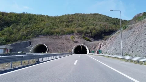POV Highway Drive Towards and Entering a Modern Road Tunnel Stockbeeldmateriaal 342220053