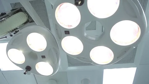 POV. Hospital patient being moved by medical staff in operating room. Stock Footage