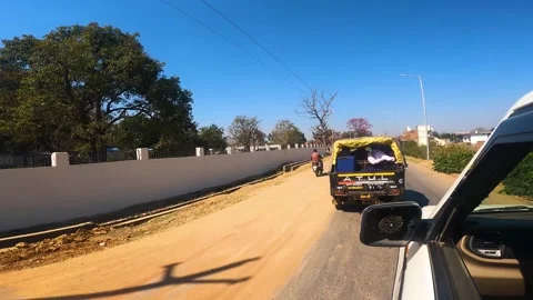 POV of Indian Road Trip Through a Small Town from Inside a Moving Car Stock Footage 312380404