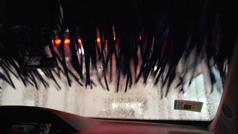 POV Inside Automatic Car Wash Blue Brushes and Foam 4K Stock Footage 336451041