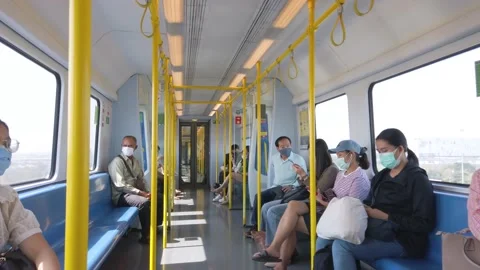 POV inside the bangkok skytrain system with some passenger Stock Footage 148035733