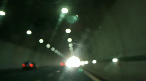 POV inside car getting out of a tunnel out of focus lights Stock Footage 40983582