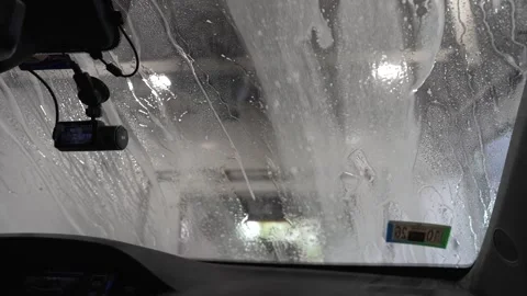 POV Inside Car Wash Final Rinse and Water Sheeting 4K Stock Footage 336448609