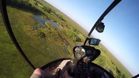 POV from the inside of a helicopter flying over the Okavango Delta Stock Footage