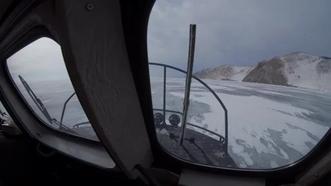 POV inside Hivus hovercraft cabin speeding across frozen Lake Baikal blazzard 4k Stock Footage 316108145