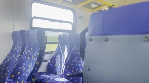 POV from inside a train traveling through sunny countryside with passing fie Stock Footage 342160956