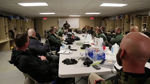 POV of Instructor and Students in SWAT Training Classroom Stock Footage 70563066