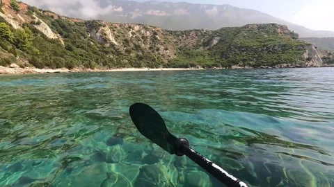 POV Kayaking Along the Clear Waters of North Kefalonia Greece Stock Footage 345177481