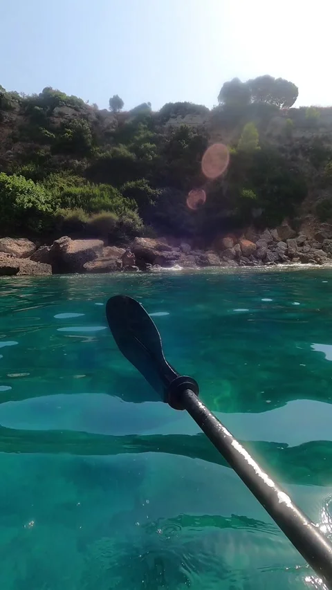 POV Kayaking Along the Clear Waters of North Kefalonia Greece Stock Footage 345177522