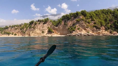 POV Kayaking Along the Clear Waters of East Kefalonia Greece Stock Footage 345177530