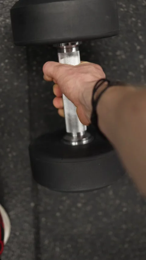 POV lifting heavy dumbbell Stock Footage 337346029