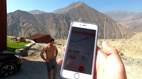 Pov looking at the cell phone after running for the measurement mileage and pace 스톡 동영상 199598475