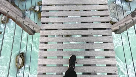 POV Looking down while walking along a bridge on the Hooker Valley Trail, New Stock Footage 318203974