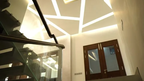 POV Looking Up Going Up Stairs Next To Glass Banister. Follow Shot Stock Footage 153668800