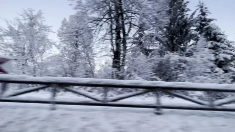 POV Looking out the window of a car driving in the snowy countryside Stock Footage 225679210