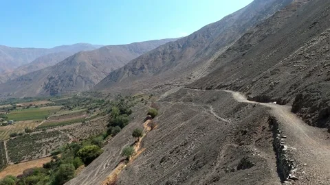 Pov looking at a trekking path with mountains in the highlands at sunny day with Vidéo 199551106