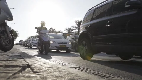 POV Low angle panning shot from sidewalk to road crossing. Downtown street view Stock Footage 144927213