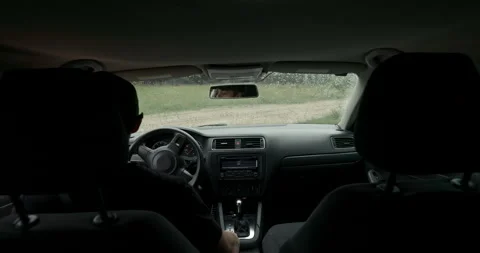 POV male driver starting engine and driving vehicle on rainy day, audio included Stock Footage 340829339