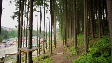 POV a man coming down the rope to pull a rope park Stockbeeldmateriaal 70507589