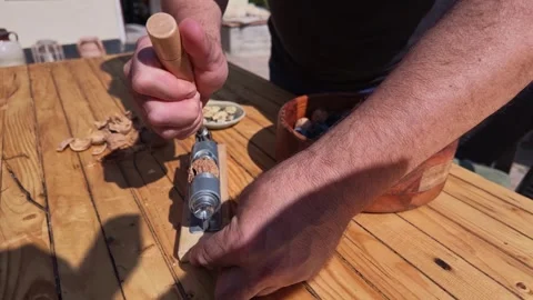 POV of Man Cracking Walnuts With Manual Device at Table Today Video stock 348028585