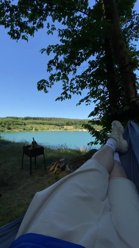 Pov man laying down in hammock with lake view Stock Footage 244113967