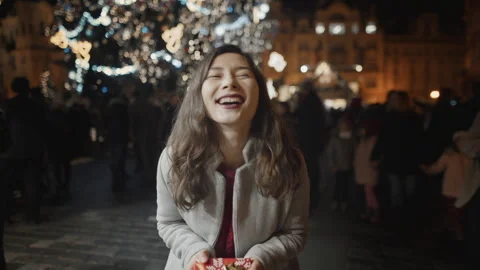 POV Man present wrapped gift box to girlfriend and woman hug camera. Happy young Stock Footage 254098256