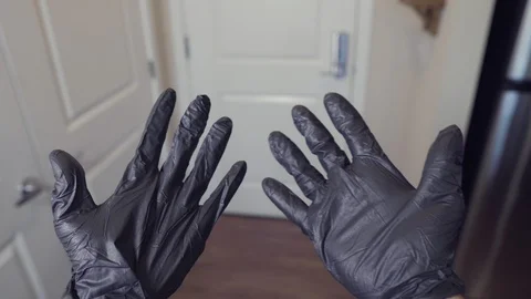 POV Man putting on protective gloves and face mask to prevent coronavirus Stock Footage 129644714