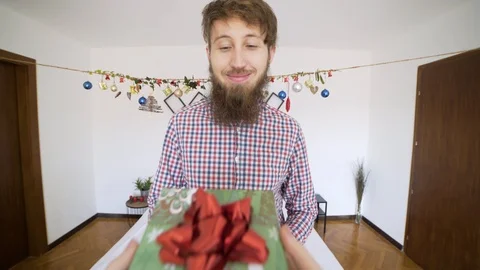 POV man receiving present and getting upset in authentic room. 動画素材 102655846