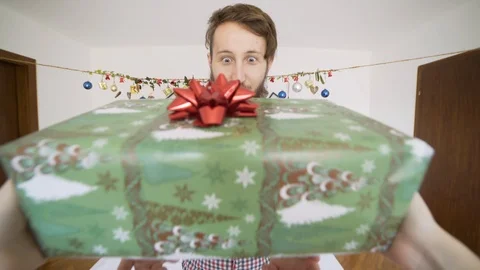 POV man receiving present and getting very happy in authentic room. Stock Footage 102655850