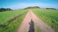 Pov Of A Man Riding His Bike Through A Small Town In A European Countryside. Stock Footage