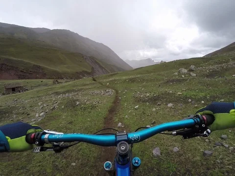 POV Of Man Riding Pristine Alpine Single Track In An Alpine Landscape With Huts Stock-Footage 78251081