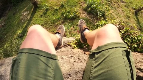 POV of a man sitting on a stone wall looking at Santiago from San Cristobal hill Stock Footage 130644853