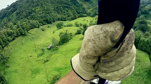 POV of a man soaring through the air on a zip line in Monteverde, Costa Rica. Video stock 41273290