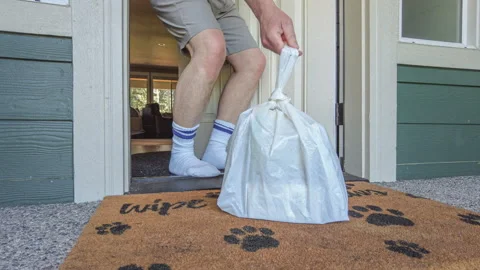 POV of Man in Socks Opening Front Door to Pick Up Grocery Delivery on Doormat Vidéo 334687755