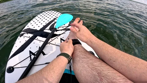 Pov man on supboard strap in Stock Footage 251709985