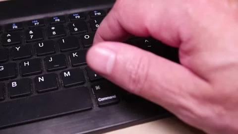 POV: man typing on a computer keyboard. Bluetooth keyboard. A wireless keyboard Stock Footage 337908203