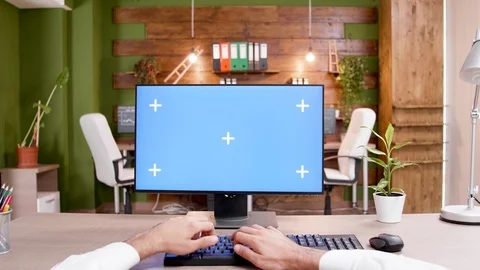 POV of man typing on mock-up PC in modern workplace Stock Footage 116770605
