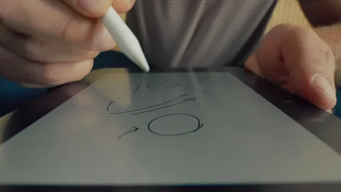 POV of a man using the tablet and drawing something Stock Footage 275145854