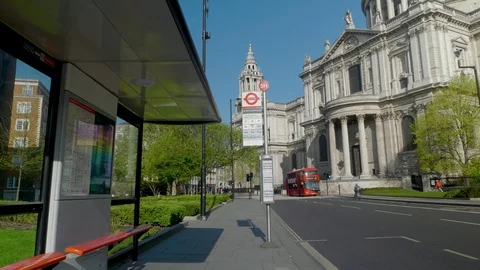 POV, man waiting in an empty bus station near St Paul Cathedral in central Vidéo 129828392