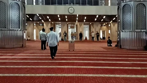 POV Man walking around the exit of the Interior of Istiqlal Mosque Stock Footage 289922377