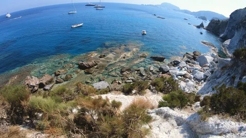POV man walking down the stone stair path to amazing bay on Ponza Island coast 스톡 동영상 98261311