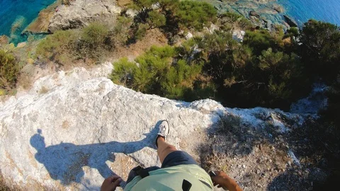 POV man walking down the stone stair path to amazing bay on Ponza Island coast Stock Footage 98264805