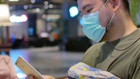 POV of a man wearing mask while using mobile phone Stock Footage 147263172