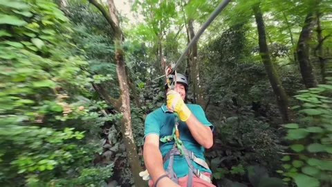 POV Man Zip lining Through Jungle Canopy in Mahe, Seychelles 001 Stock Footage 342935275