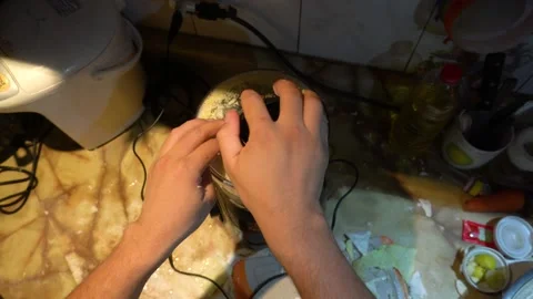 POV man's hands using a food processor to shred a cabbage vegetable Stock Footage 146004910